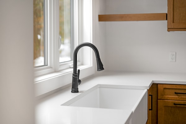 Modern kitchen faucet showing the precision plumbing that camera inspections help maintain