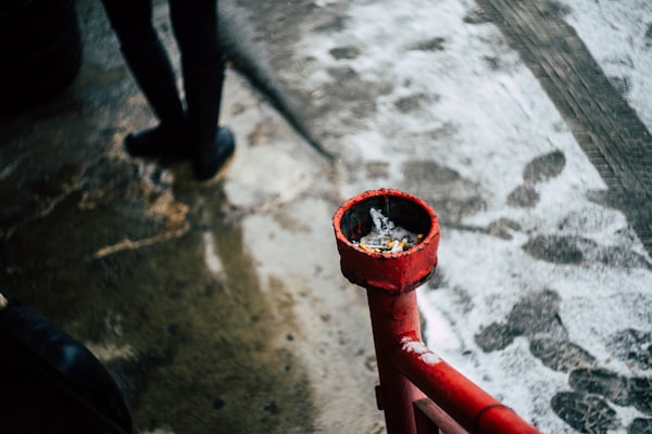Red pipe valve representing water heater system connections